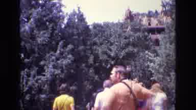 Colorado USA (1973): People Walking Through Forest Towards Tipis On Hills And