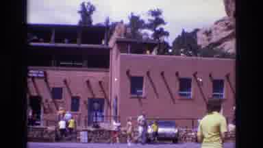 Colorado USA (1973): People Walking Around And On Stone Building In Daytime