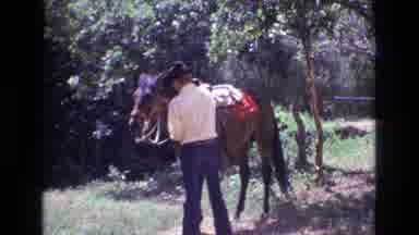 Colorado USA (1973): Cowboy Mounting And Riding Around On His Horse In The Open