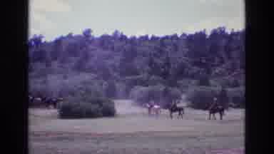 Colorado USA (1973): People Riding Horses Across A Field