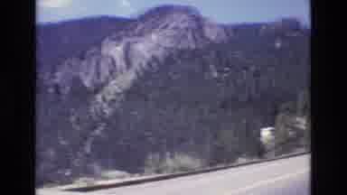 Colorado USA (1973): Red Car Drives Through Mountain Highway