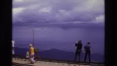 Colorado USA (1973): People Standing On Bridge Overlooking Ocean
