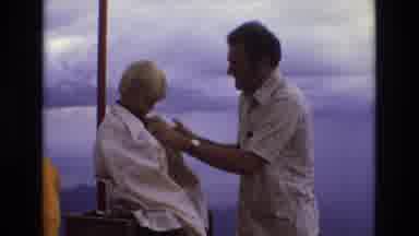Colorado USA (1973): Human Caucasian Man Covering Cold Child With Shirt