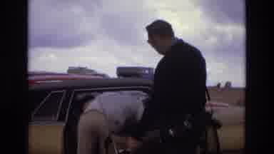 Colorado USA (1973): Rural Mountain Range With Cloudy Skies And Two Guys By A Car