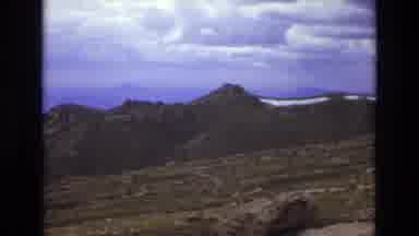 Colorado USA (1973): Man Standing Alone On A Rocky Mountain On A Cloudy Day