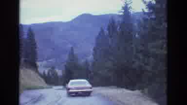Colorado USA (1973): Dashboard View Of Driving Through Mountains On A Rainy Day