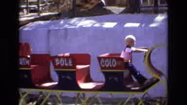 Colorado USA (1973): A Young Blonde Boy Sitting On A North Pole Sleigh