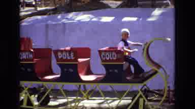 Colorado USA (1973): Blonde Hair Boy Riding Giant Sled