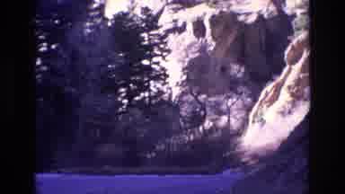 Colorado USA (1973): Approaching Mountain Scene Showing A Cave Trees And A Rocky