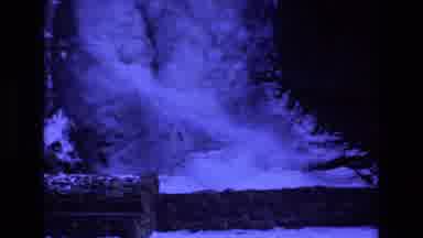 Colorado USA (1973): Water Flowing Under A Frozen Waterfall Trees Cut Down Nearby