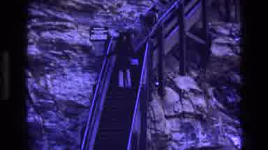 Colorado USA (1973): Woman Carrying Purse Walking Down A Long Flight Of Stairs