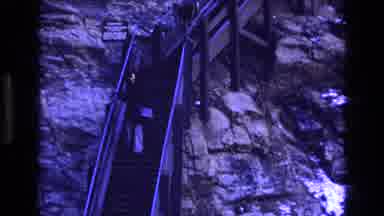 Colorado USA (1973): Man And Woman Goes Down Long Stairs Lean On The Handrail