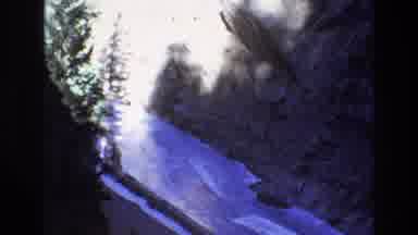 Colorado USA (1973): River Flowing Through A Mountain Valley With Pine Trees