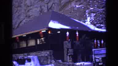Colorado USA (1973): White Jeep Parked Outside Mountainside Home In The Evening