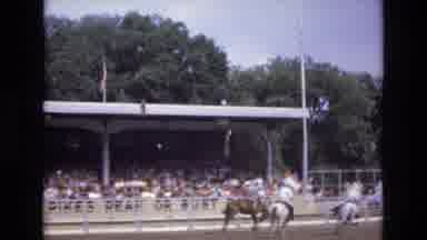 COLORADO SPRINGS COLORADO USA .-1973: A Bronc Rider Being Assisted By Two Pickup