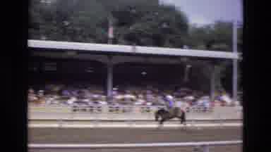 COLORADO SPRINGS COLORADO USA .-1973: Man In Blue Shirt Riding Bucking Bronco At