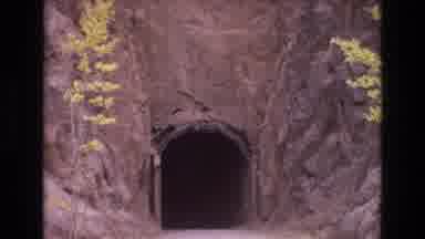 COLORADO SPRINGS COLORADO USA .-1973: A Road Entering Dark Tunnel Dug Into The
