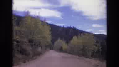 COLORADO SPRINGS COLORADO USA .-1973: A Narrow Mountain Road Lined With Light