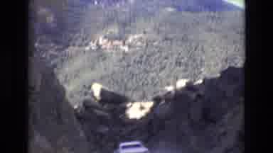 COLORADO SPRINGS COLORADO USA .-1973: A Car Drives Down A Steep Mountainous Road