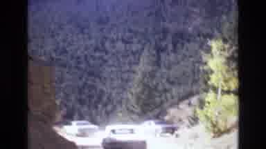 COLORADO SPRINGS COLORADO USA .-1973: Car Driving On Dirt Road Mountains Trees