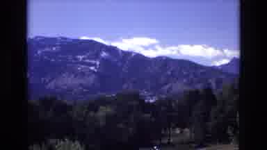 COLORADO SPRINGS COLORADO USA .-1973: Clouds Lazily Drift Above A Mountain Range