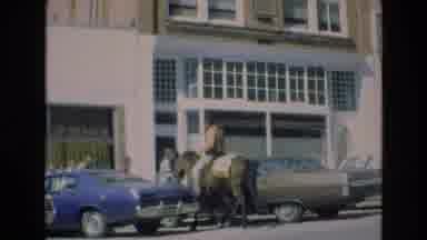 COLORADO SPRINGS COLORADO USA .-1973: Horseback Rider Approaching Storefront
