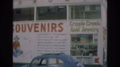 COLORADO SPRINGS COLORADO USA .-1973: Storefront With A Blue Car That Sells Gold
