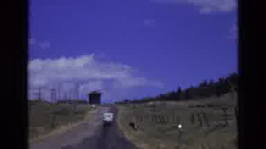 COLORADO SPRINGS COLORADO USA .-1973: A Car Driving Along On A Empty Road In A