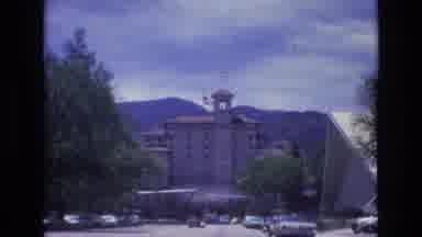 COLORADO SPRINGS COLORADO USA .-1973: Flags In The Buildings Cars Parked In The