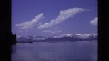 Lake Tahoe Nevada USA (1973): View Of Snow Capped Mountains Over Reflective Lake
