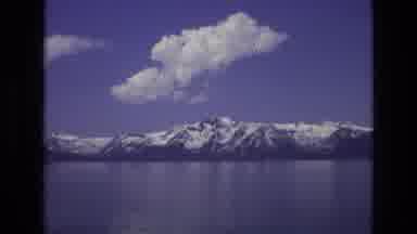 Lake Tahoe Nevada USA (1973): A Snow-Capped Mountain Range Runs Along The Coast Of