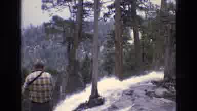 Lake Tahoe Nevada USA (1973): A Waterfall Spills Over A Rocky Cliff While A Man