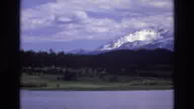 Lake Tahoe Nevada USA (1973): Cloudy And Snow Capped Mountains Viewed Across Lake