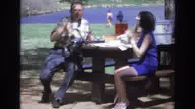 Lake Tahoe Nevada USA (1973): Man And Woman Sitting At A Park Bench Drinking