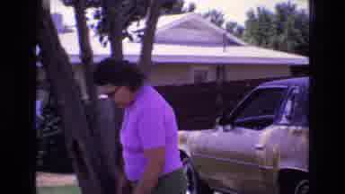 New Mexico USA (1973): Lady Outside Moving Table Near Cars
