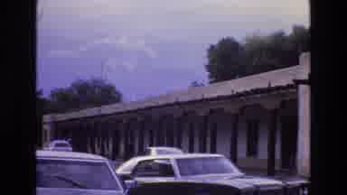 New Mexico USA (1973): Cars Driving In Front Of Building