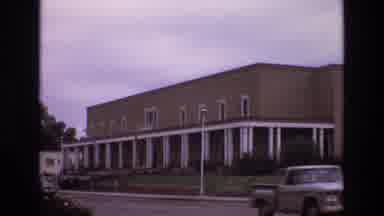 New Mexico USA (1973): Building Trucks Landscaping Columns Large Bushes Road