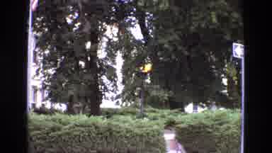 New Mexico USA (1973): A Burning Torch And A Flag On A Building