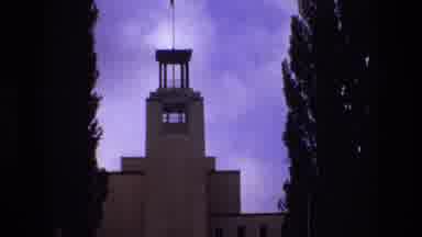 New Mexico USA (1973): Building Tower With Tall Windows Nestled Between Trees