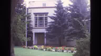 New Mexico USA (1973): Adobe Style Buildings With Evergreens And Flowers