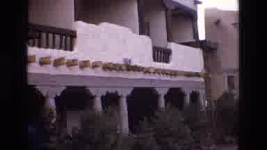 New Mexico USA (1973): White Villa In Village With Hedgerow Growing Along The