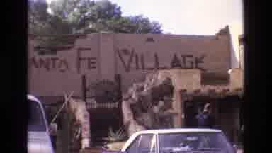 New Mexico USA (1973): Brown Building With Cars Parked In Front