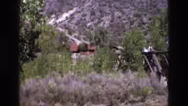NEW MEXICO USA-1973: Hill Country Landscape With Cabin And Arid Hills
