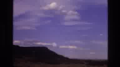 New Mexico USA (1973): A Rocky Mount Beneath A Clear Blue Sky