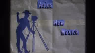 New Mexico USA (1973): A Sign Of A Cowboy With An Old Camera Who Is Saying Goodbye
