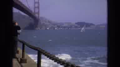 San Francisco California USA (1973): Man Standing On Bridge Watching Boat Floating