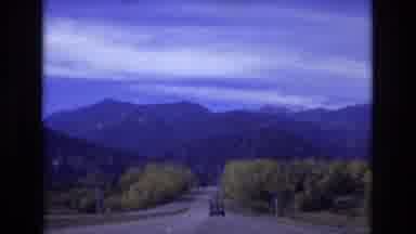 Colorado Springs Colorado USA (1974): A Vehicle Driving Behind A Jeep In A
