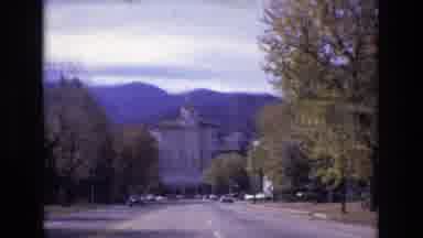 Colorado Springs Colorado USA (1974): Driving Down Road To Large Building