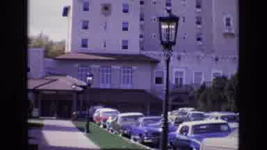 Colorado Springs Colorado USA (1974): Old Car Tall Tan Building Lamp Post Road