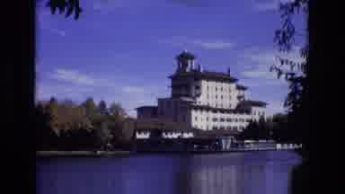 Colorado Springs Colorado USA (1974): A Tall Building Looms Over A Lake